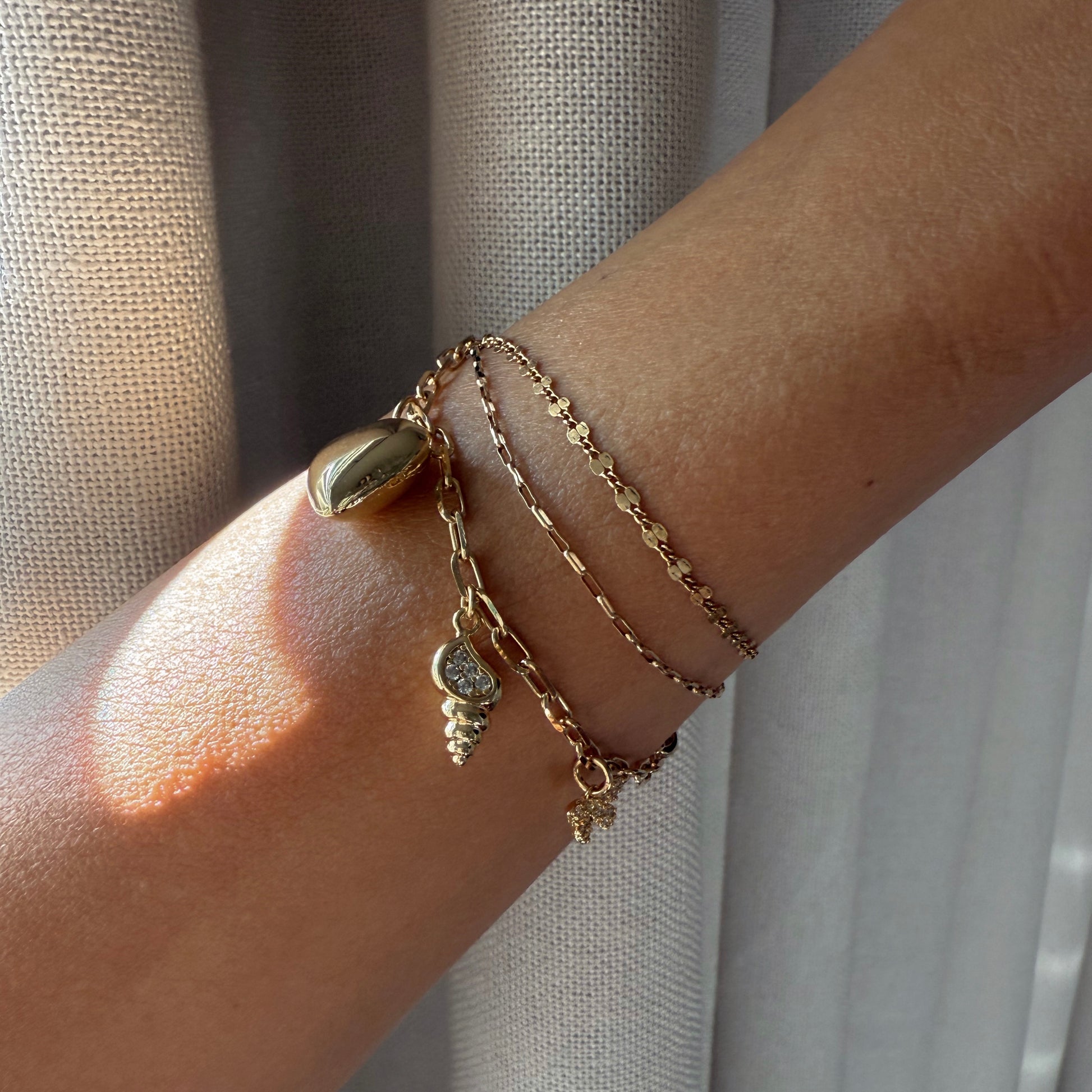 Puffy heart and shell charm bracelet
