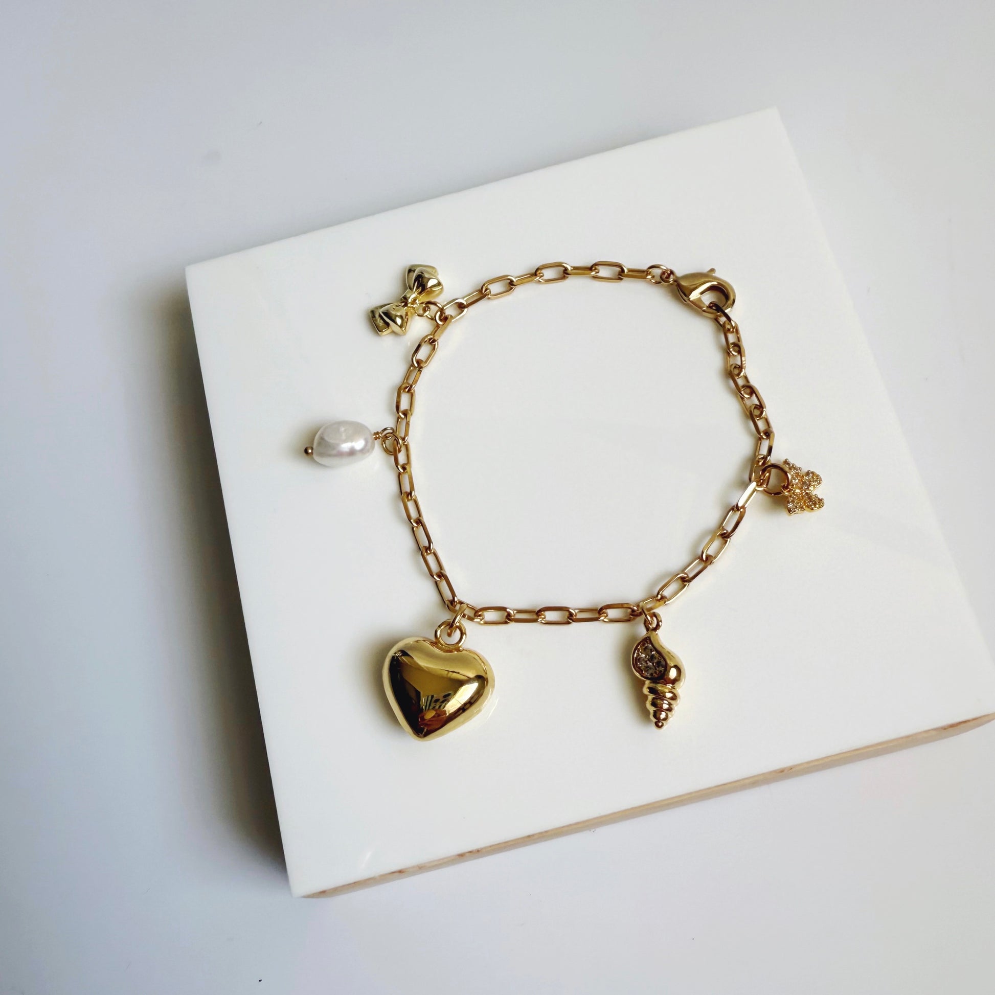 Puffy heart and shell charm bracelet