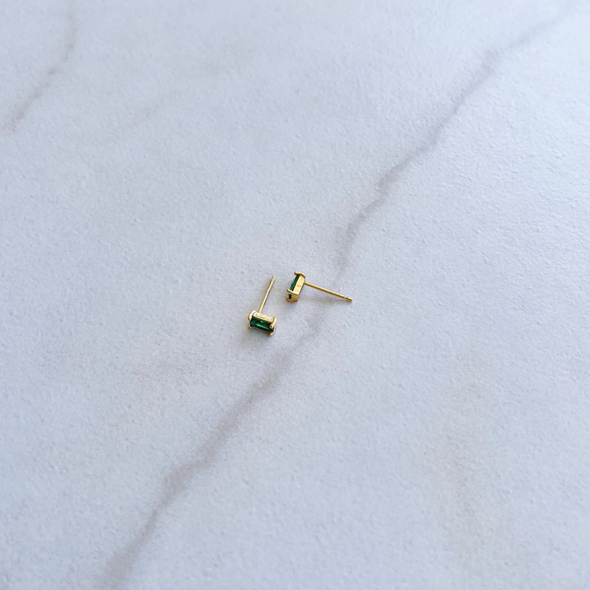 Emerald baguette studs