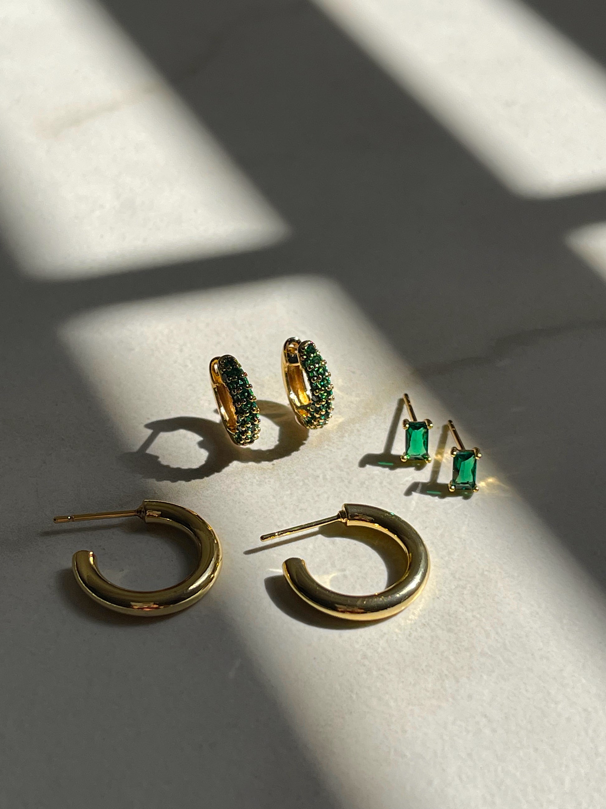 Emerald baguette studs